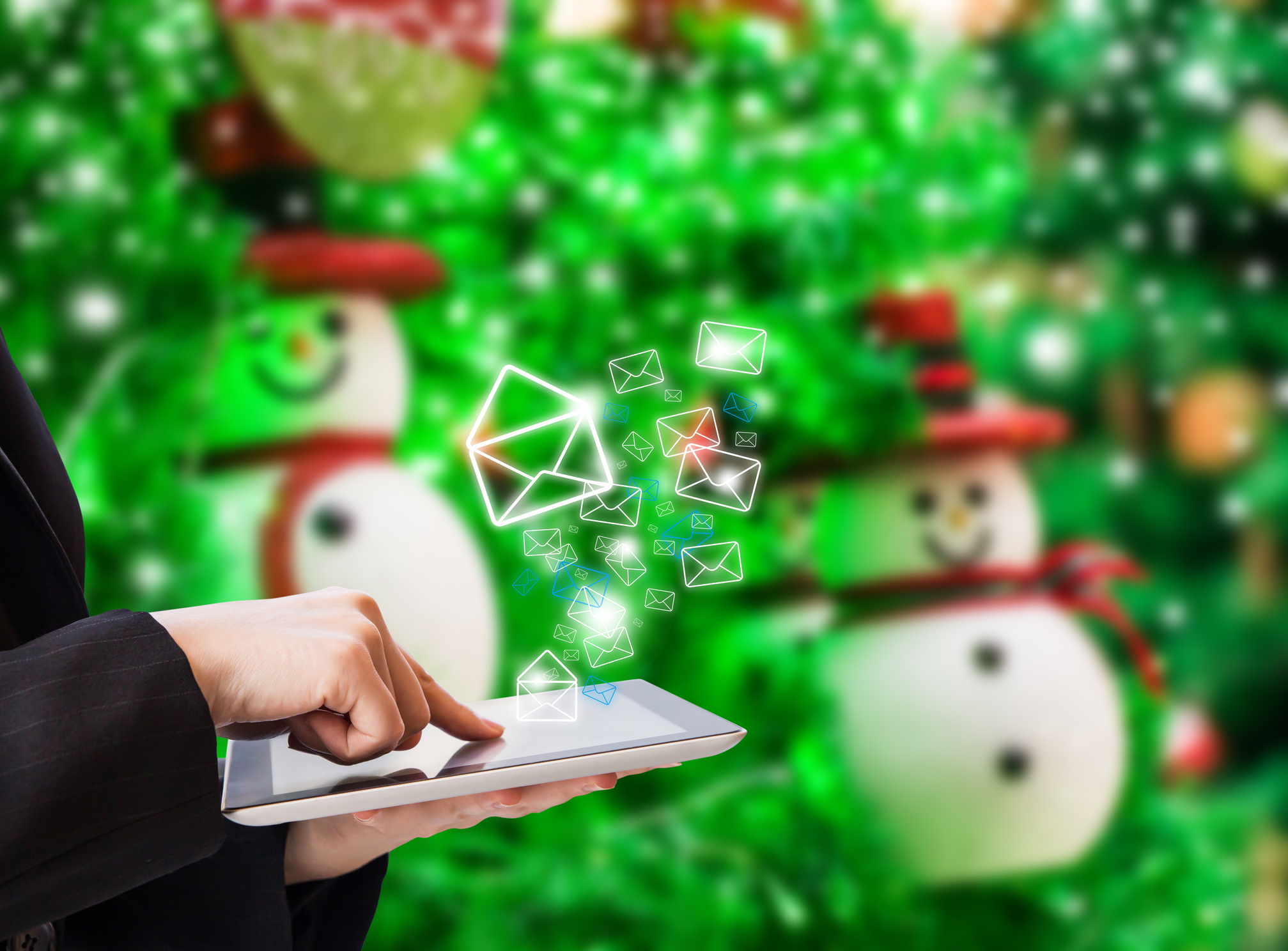 Composite image of person using tablet and Christmas tree background